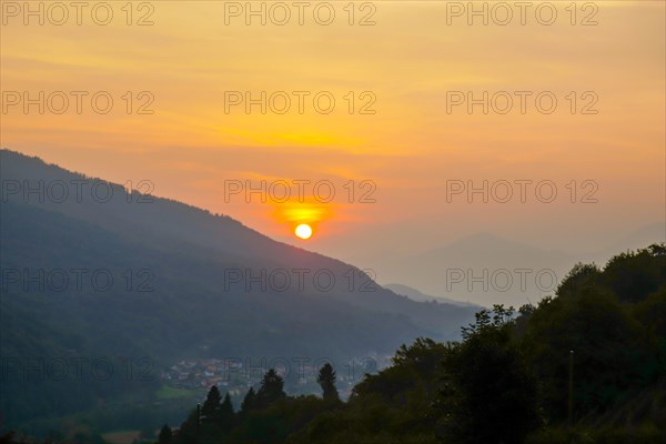 Beautiful Sunset in a Valley with Mountain Range and Sky in Malcantone