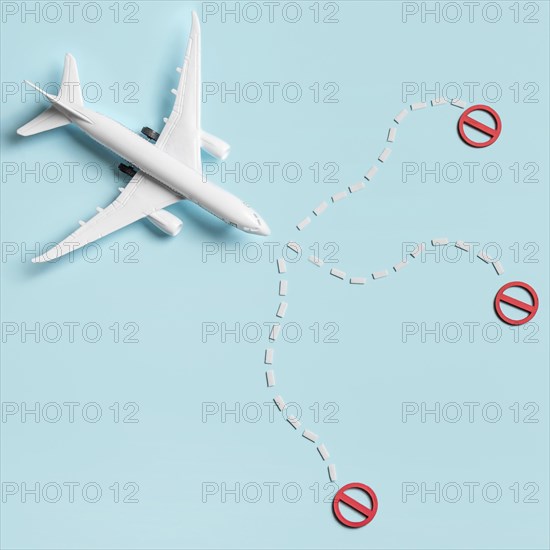 Flat lay plane toy blue background