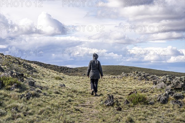 Women hikes through the Patagonian steppe