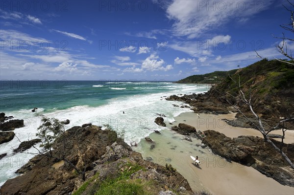 Surfer on the beach of Byron bay