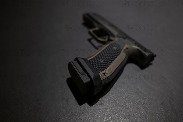 Modern Elegant Handgun on Grey Background in Switzerland