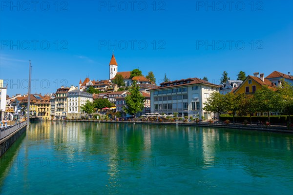 City of Thun and River Aare with Castle and Church in a Sunny Day in Bernese Oberland