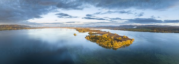 Aerial panorama of the Mettnau peninsula in western Lake Constance illuminated by the morning sun