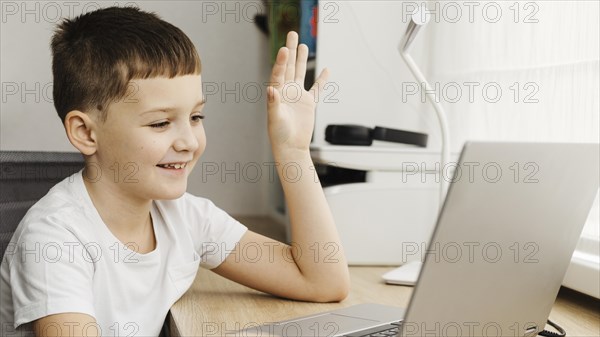 Boy attending online course