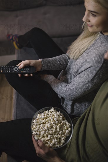 Crop couple watching tv sofa