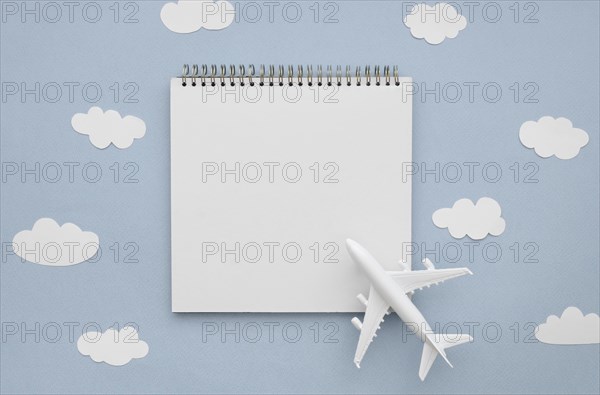 Frame clouds with airplane notebook