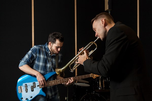 Guitarist trumpet player performing