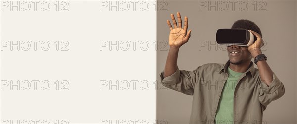 Afro american man using virtual reality headset copy space