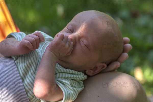 Infant in the mother's hand