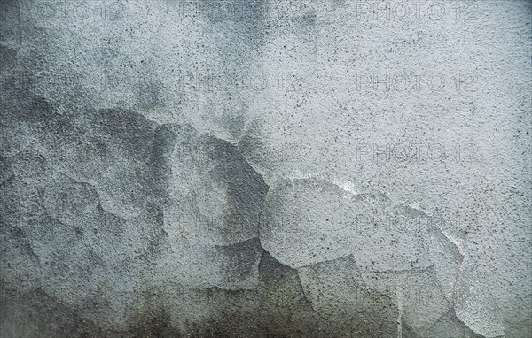 Textured old wall background. Texture of a gray wall. Old wall with cracked texture. Cracked cement wall background. Textured and cracked wall