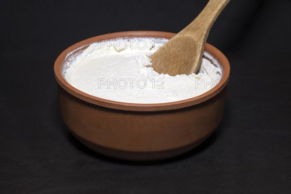 Original Turkish Kaymakli yoghurt matured in a clay bowl