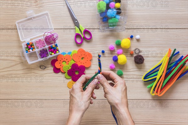 Close up person s hand making handmade jewelry