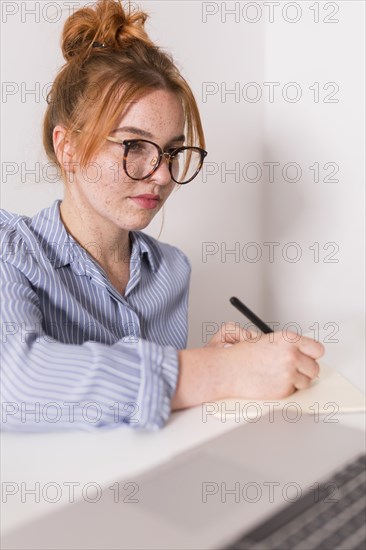 Female teacher paying attention students during online class