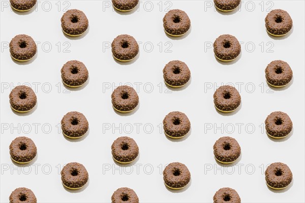 Bakery pattern with chocolate donuts