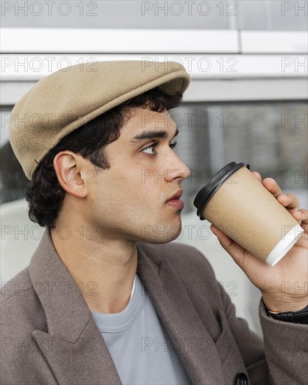 Close up man drinking coffee