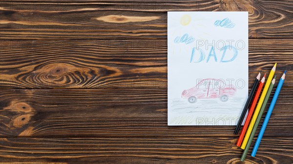 Dad inscription with car drawing paper sheet