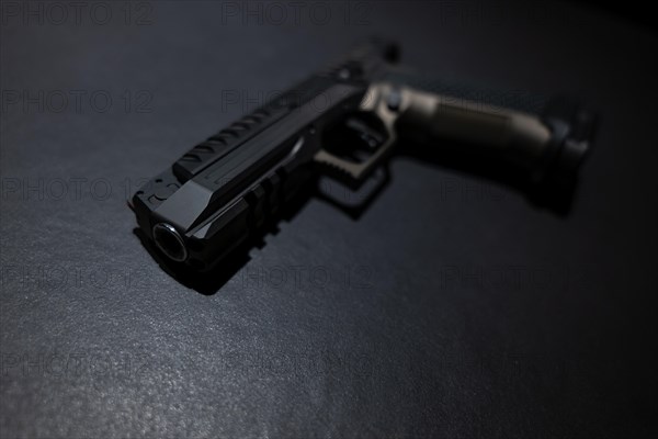 Modern Elegant Handgun on Grey Background in Switzerland