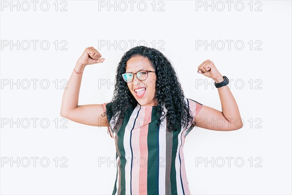 Happy woman raising arms in victory gesture isolated. Winning people celebrating triumph. Excited afro girl raising arms celebrating victory