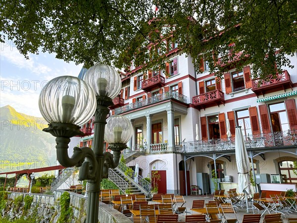 Grandhotel Giessbach with Terrace and Street Lamp in a Sunny Summer Day in Brienz