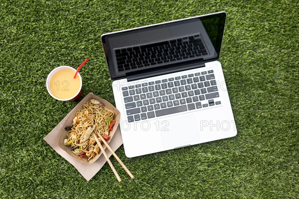 Laptop chinese food grass background
