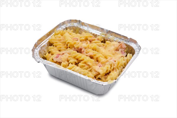 Mac and cheese with prosciutto in foil container isolated on white background