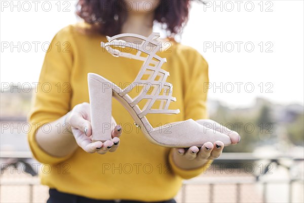 Brunette blogger showing heel camera