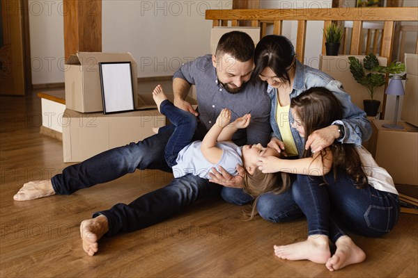 Full shot family playing together