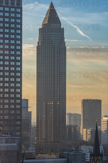 Sunset between skyscrapers. Cityscape with modern office buildings and streets. Insurance companies and banks as a cityscape in Frankfurt am Main