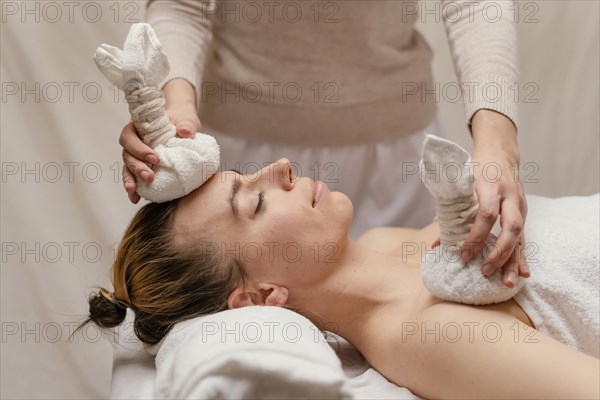Close up therapist holding wet towels