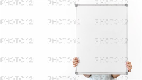 Close up hands holding blank board