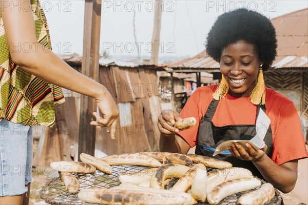 Close up smiley woman making food