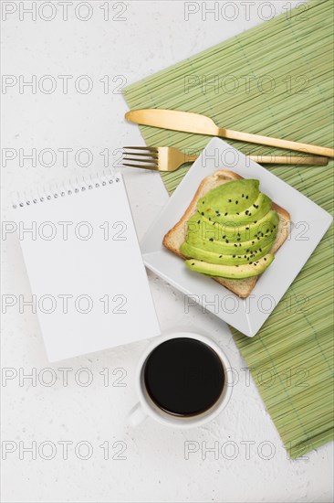 Flat lay delicious breakfast with avocado