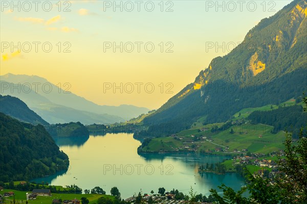 View over Lake Lungern and Village with Mountain in Sunset in Lungern