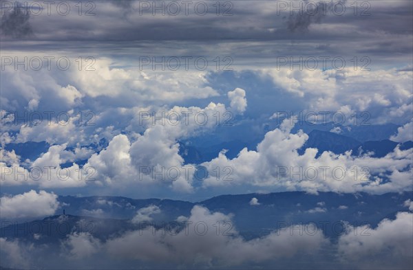 Dramatic cloudy sky on the Gerlitzen with a view of the Klagenfurt basin with the Pyramidenkogel observation tower