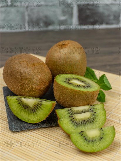 Fresh kiwis sliced on a plate