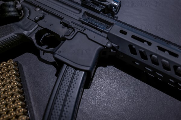 Modern Elegant Assault Rifle and Bullet on Grey Background in Switzerland