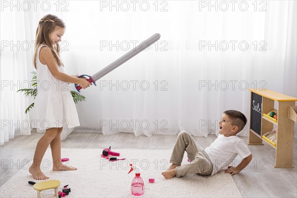 Kids playing with sword toys