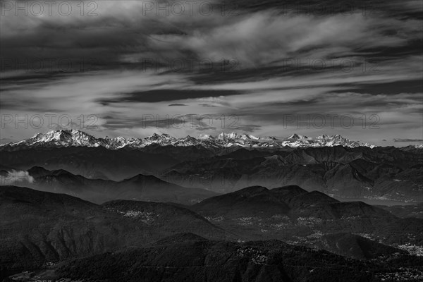 Aerial View over a Beautiful Mountainscape and And Snow Capped Monte Rosa and Mountain Peak Matterhorn and with Floating Clouds in a Sunny Day in Ticino