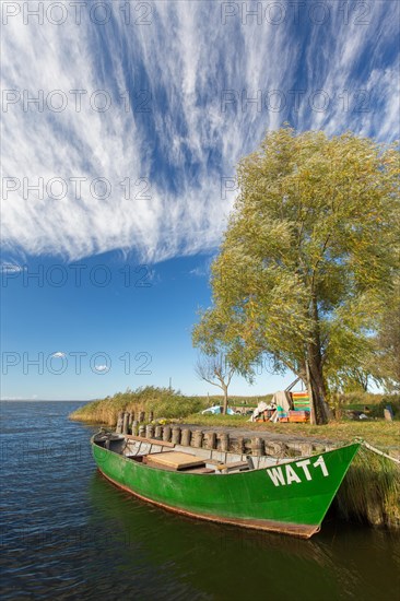 Fishing boat in small harbour of the Achterwasser at Warthe near Rankwitz on Usedom island in the Baltic Sea