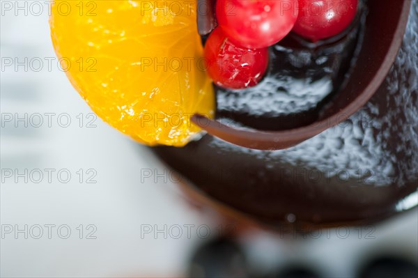 Chocolate cake and fresh fruit on top closeup macro