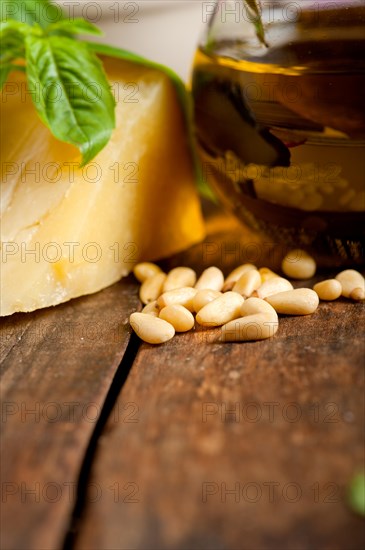 Italian basil pesto ingredients over old wood macro