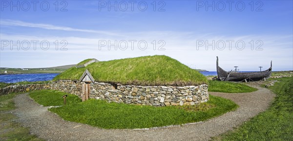 Reconstruction of Norse Viking longhouse and the Skidbladner