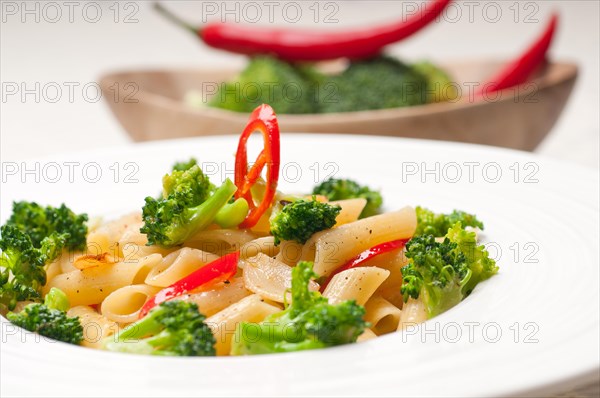 Classic Italian penne pasta with broccoli and red chili pepper