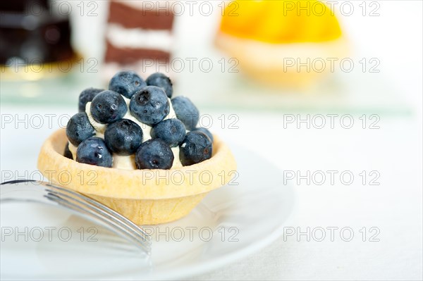 Fresh blueberry cream cupcake homemade closeup macro