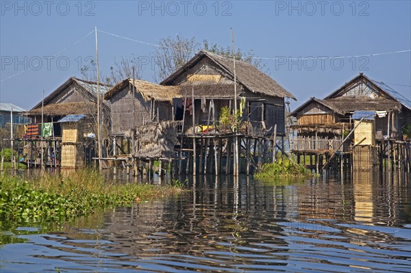 Intha lakeside village with traditional bamboo houses on stilts in Inle Lake