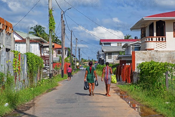 Local black women walking down street in New Amsterdam