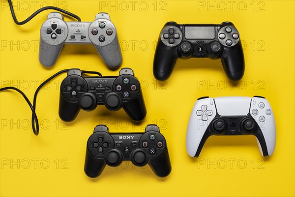 Different generations of game controllers of the Playstation game console