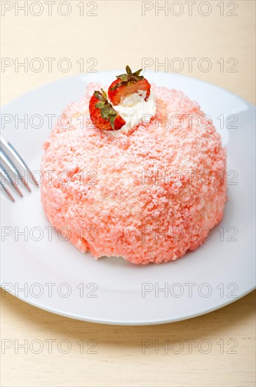 Fresh pink strawberry and whipped cream dessert macro close up