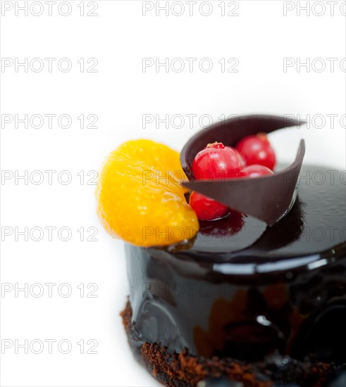 Chocolate cake and fresh fruit on top closeup macro