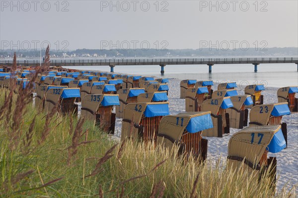 Roofed wicker beach chairs along the Baltic Sea at Scharbeutz